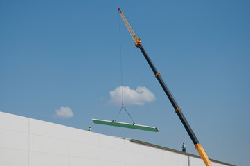 Sandwich panels at the construction site. Material for warming the walls of the building. Technologies in construction. An alternative to a brick building.