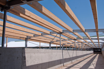 Wooden beams on steel structure for further construction. Metal frame for the installation of insulation panels. Construction of pre-fabricated buildings.