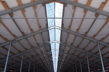 Thermal insulation of the metal frame of the building with insulation panels. The process of installing insulation panels. Modern building insulation.