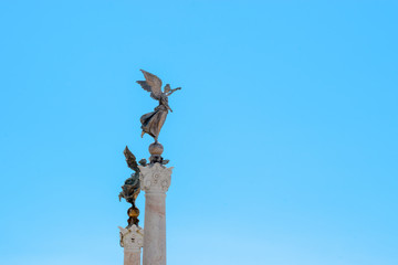 Winged woman statue in front of Altare della Patria, Piazza Venezia, Rome Italy