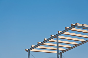 Wooden beams on steel structure for further construction. Metal frame for the installation of insulation panels. Construction of pre-fabricated buildings.