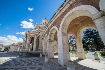 Fototapeta na wymiar Church of San Antonio in Aranjuez, Madrid, Spain. Stone arches and walkway linked to the Palace of Aranjuez