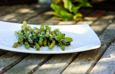 Bunch of fresh asparagus on wooden table