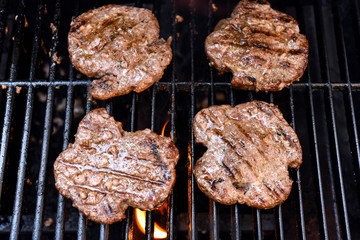 Grilling burgers on a barbecue