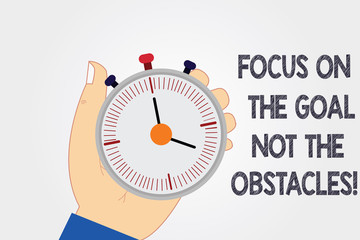 Handwriting text writing Focus On The Goal Not The Obstacles. Concept meaning Be determined to accomplish objectives Hu analysis Hand Holding Mechanical Stop Watch Timer with Start Stop Button