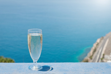 Wineglass with crystal champagne on the balcony of the luxurious hotel.