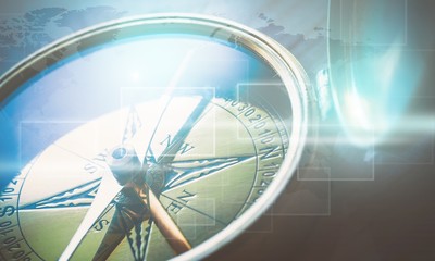 Brass antique compass  on background