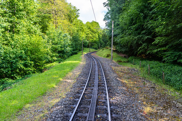 Cog railway tracks with an additional toothed rack located in the middle of the track to overcome...