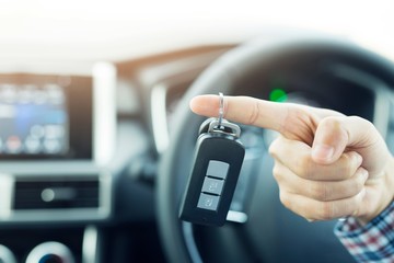 Men's hands and key car in the car, transportation, driving