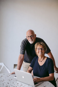 Couple using technolgy at home