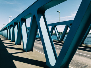 Turquoise Steel Bridge With Triangular Design Elements