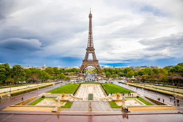 Fototapeta premium Aerial view of Tower Eiffel on beautiful cloudy sky in Paris, France