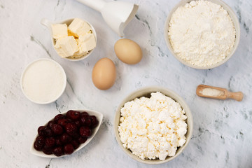 Ingredients for the preparation of cake with cherries: flour, baking powder, eggs, cottage cheese, butter, sugar and cherry