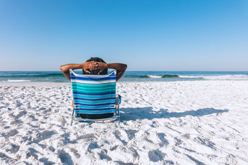 Black woman relaxing on the beach
