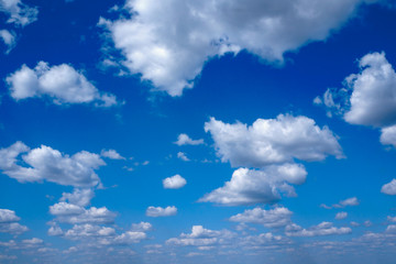 Brilliant, dramatic blue sky with clouds.