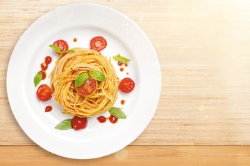 Delicious pasta on white plate on  background