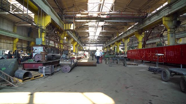 manufacturing facility, factory shop,work on metal in the factory, huge crane in the factory