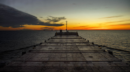 Fototapeta na wymiar Beautiful sunrise at sea. View from bridge of cargo vessel.