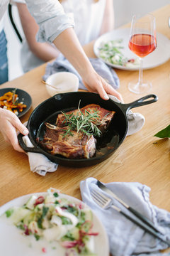 Lamb chops being served on table