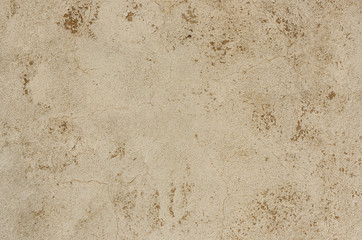 Photo of light concrete texture of the background with cracks. Wall background