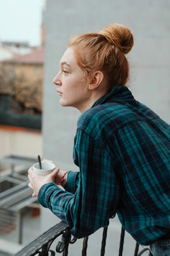 Woman relaxing on her balcony