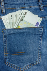 Close Up View to 100 Euro Banknotes Sticking Out From a Blue Jeans Pocket
