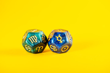 Astrology Dice with zodiac symbol of Virgo Aug 23 - Sep 22 and its ruling planet Mercury on Yellow...