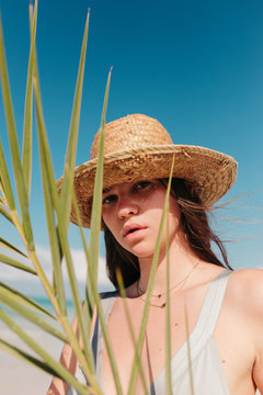 Tropical young woman with a hat