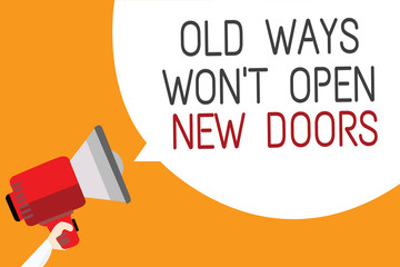 Text sign showing Old Ways Won t not Open New Doors. Conceptual photo be different and unique to Achieve goals Man holding megaphone loudspeaker speech bubble message orange background
