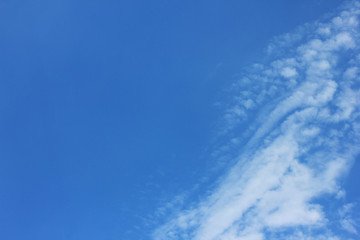 Naklejka na ściany i meble Blue sky nature image with small clouds on bright sunny day 