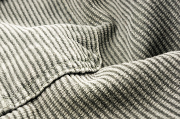 clothing items stonewashed cotton fabric texture with seams, clasps, buttons and rivets, macro
