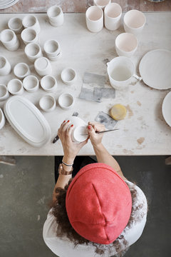Ceramist Glazing Porcelain Pot