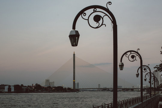 Lamp posts over a river.