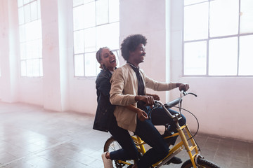Funny couple with bike.