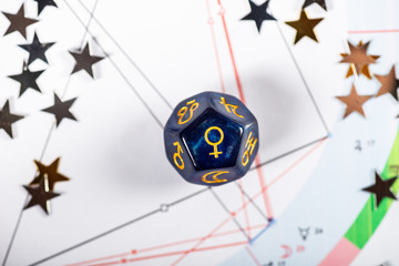 Astrology Dice with symbol of the planet Venus on Natal Chart Background