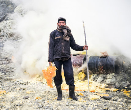 Portrait of man standing in steam eruption