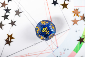 Astrology Dice with symbol of the planet Pluto on Natal Chart Background