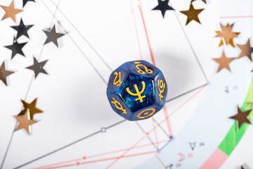 Astrology Dice with symbol of the planet Neptune on Natal Chart Background