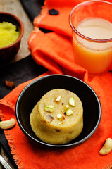 Indian Sooji mango Halwa on a wood background