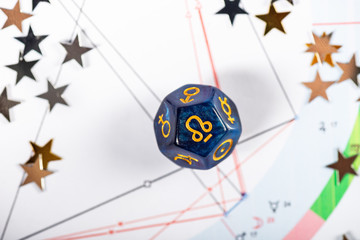 Astrology Dice with symbol of Rahu on Natal Chart Background