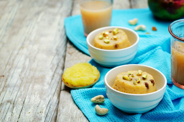 Indian Sooji mango Halwa on a wood background