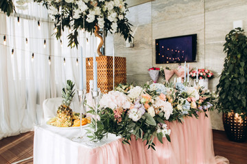 luxury wedding table with beautiful flowers. pink stylized