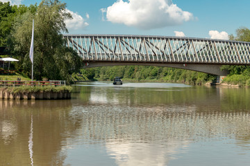Fototapeta premium Bridge over the river Neckar with rib pattern and reflection on the river Neckar