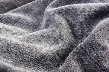 clothing items stonewashed cotton fabric texture with seams, clasps, buttons and rivets, macro