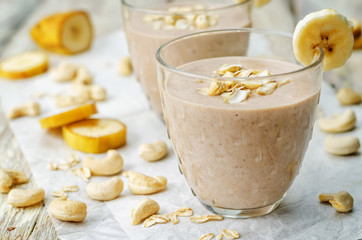 cashew banana cocoa oats smoothie on a wood background