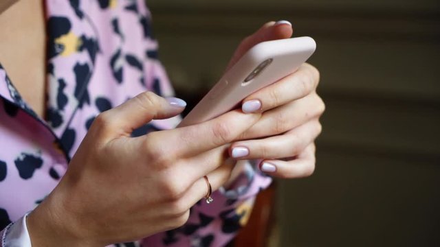 Woman using mobile phone closeup