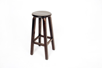 wooden chair on a white background. bar stool made of dark wood.