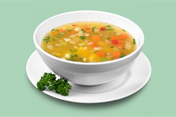 Bowl of delicious vegetables soup on  table