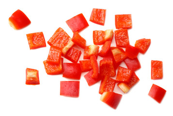 cut slices of red sweet bell pepper isolated on white background top view