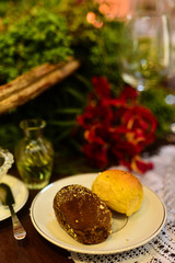 plate with cheese bread and Australian olive oil bread and glass of wine on the table, baker's day